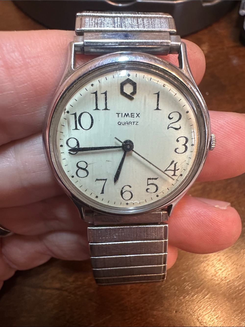 1980s Vintage Timex Men's Silver Case Watch with Cream Dial and Black Hands